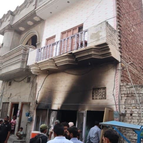 A family home blackened by fire