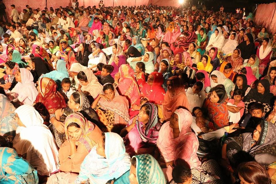 Women and children filling the ground at a church gathering
