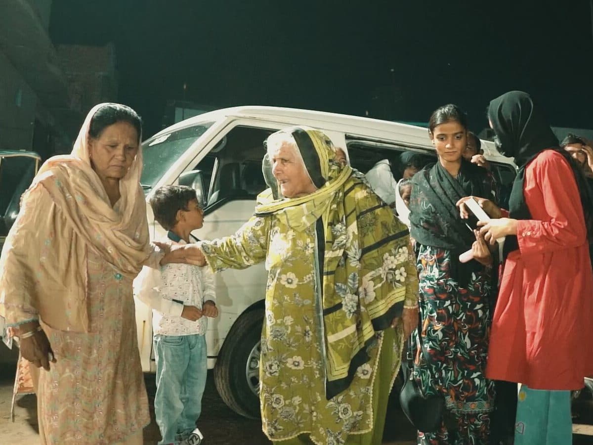 Women from the church greeting one another
